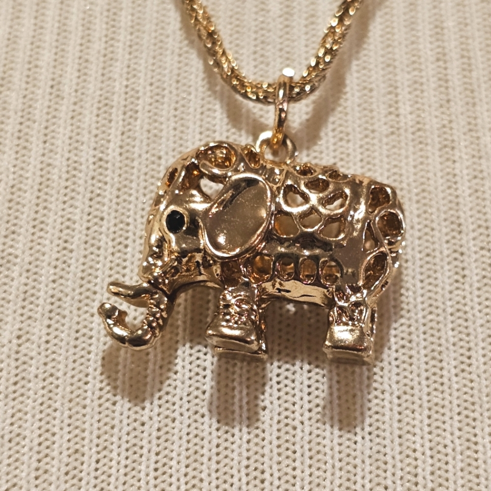 Goldtone filigree elephant pendant on a twisted goldtone chain